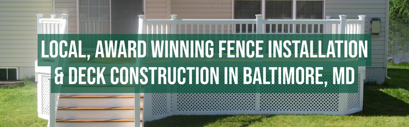 White vinyl deck with railing and lattice skirting attached to a beige house, with green lawn in the foreground. Overlaid text reads: “Local, award winning fence installation & deck construction in Baltimore, MD.”